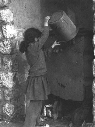 Girl emptying garbage