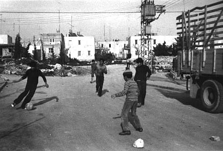 Playing soccer in front of Block 102