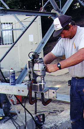 Rusty drills the L brackets with one big drill