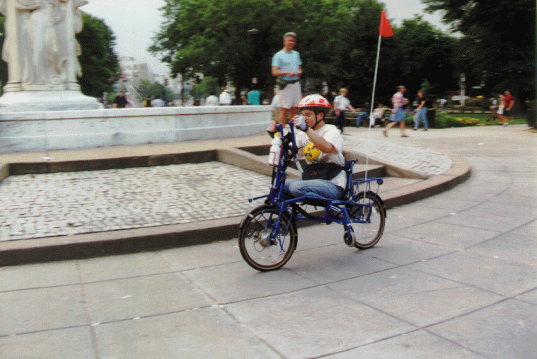 [PHOTO: Jen riding handbike]