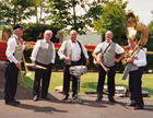 band playing to welcome guests to the reserved enclosuer