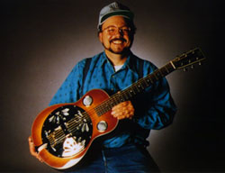 Randy Allen holding one of his resonator guitars